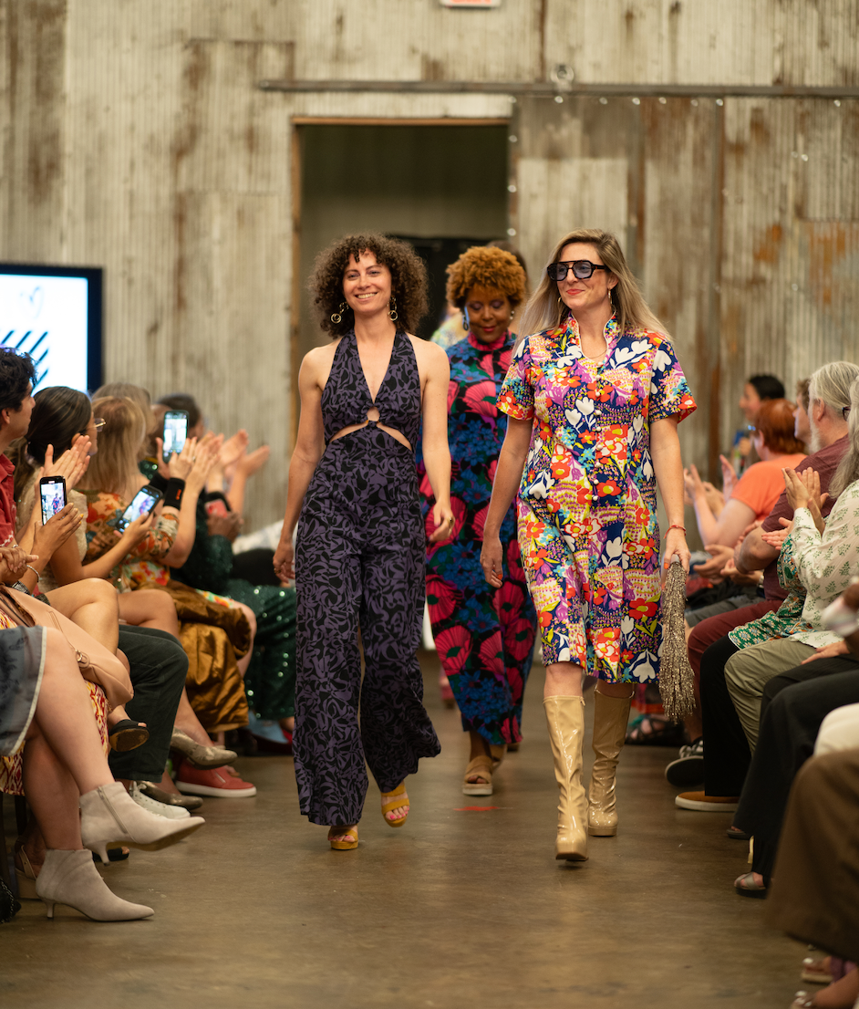 Models walking the runway at the ReFashion Show in Alexandria, VA, wearing colorful thrifted and upcycled outfits